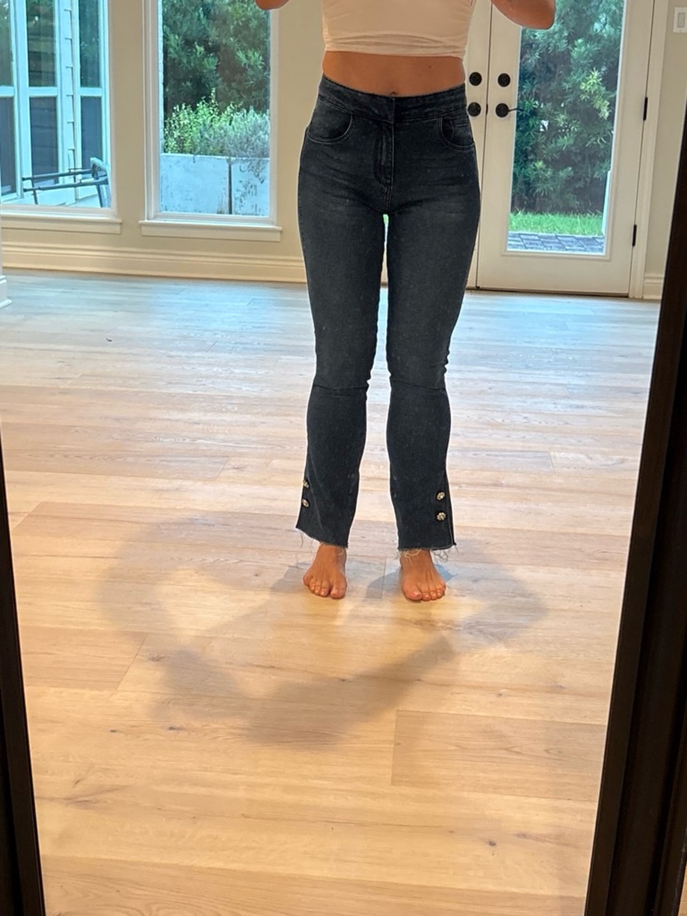 LE LIS DENIM Dark wash denim jeans with button details on the bottom